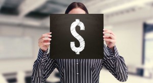 Businesswoman showing board against classroom